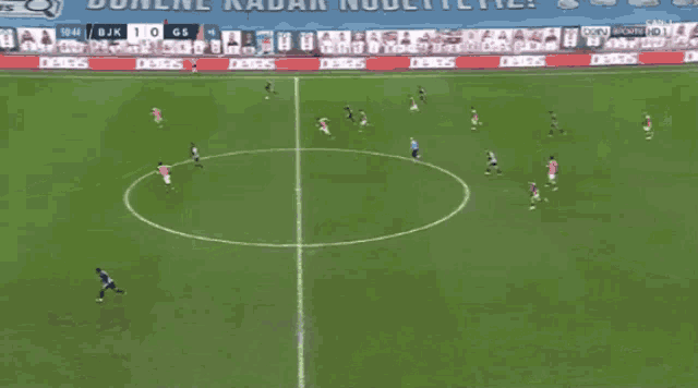 a soccer game is being played in front of a banner that says jotun on it