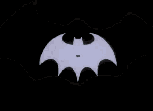 a black and white batman logo with a bat flying in the middle .
