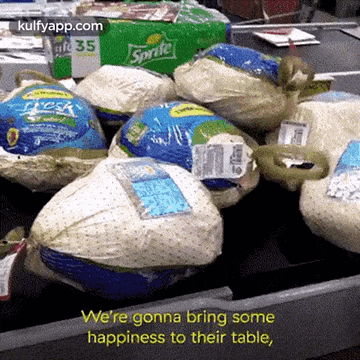 a bunch of turkeys are sitting on a conveyor belt with a sprite box in the background ..