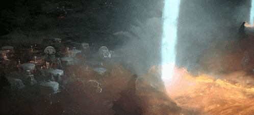 a group of people are standing in a dark room surrounded by fire and smoke