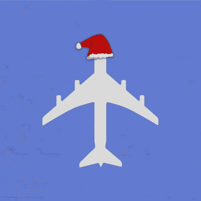 a white airplane with a santa hat on top of it