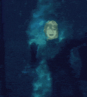 a blurry picture of a person in a wet suit in the water