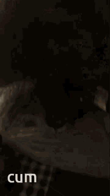a close up of a person 's face with the word cum on the bottom left