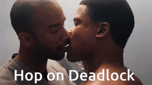 a couple of men kissing with the words hop on deadlock below them
