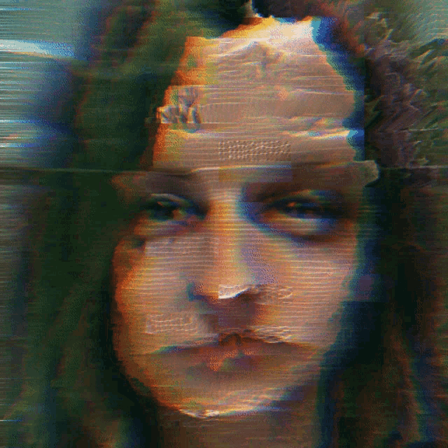 a close up of a person 's face with a blurred image