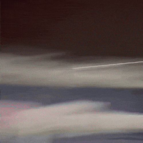 a blurry picture of a plane flying in the sky