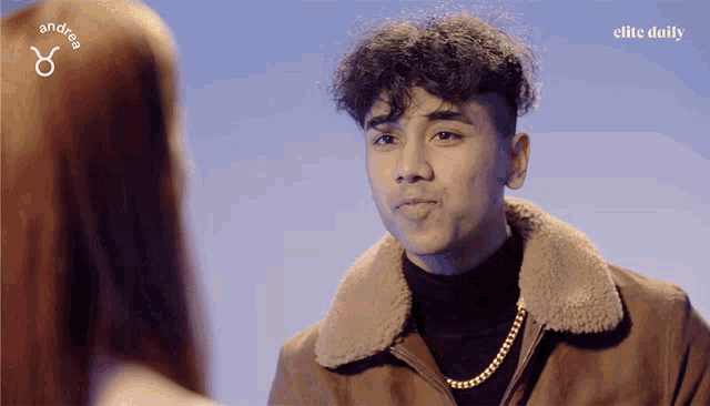 a man and a woman are looking at each other with the elite daily logo in the corner