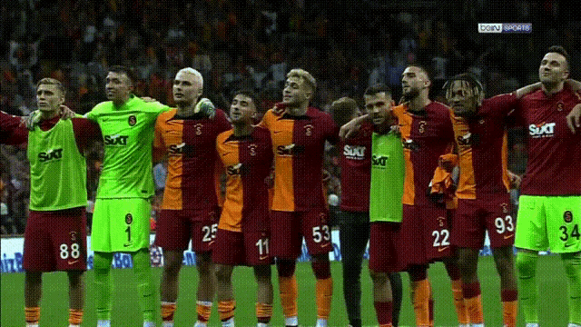 a group of soccer players wearing shirts that say suxt on them