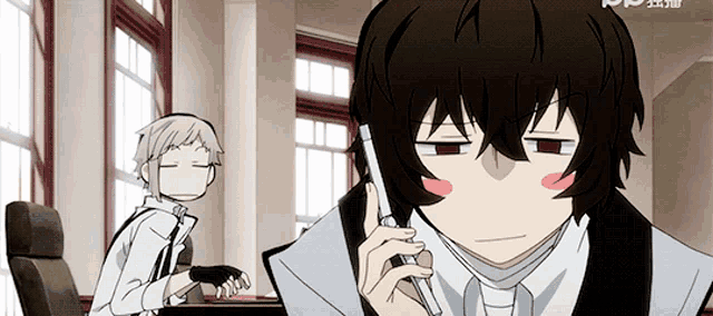 a man in a suit and tie is talking on a phone