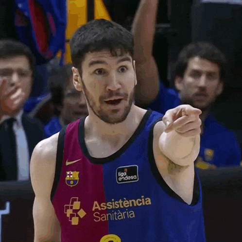a basketball player wearing a uniform that says assistance sanitaria