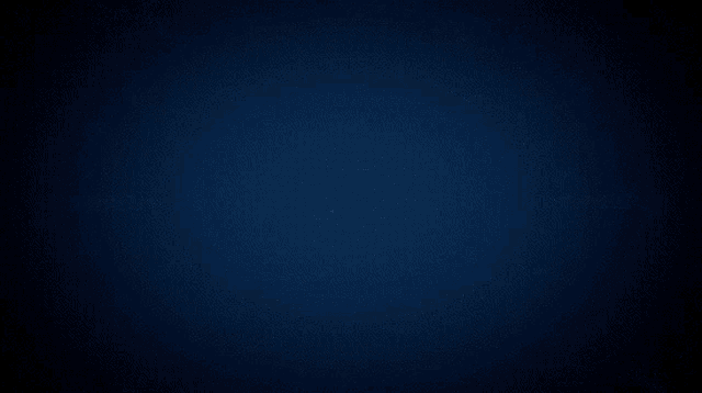 a bright blue light shines in the dark