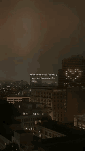a city at night with a quote in spanish