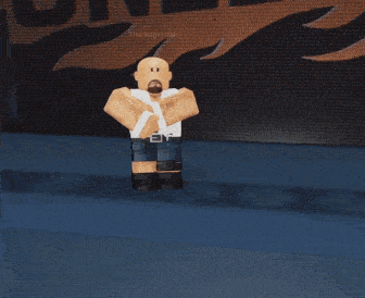 a bald man with a beard wearing a white shirt and blue shorts stands with his arms crossed
