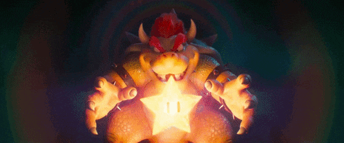 bowser is holding a star in his hands in a video game .