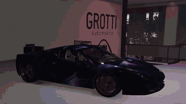 a car is parked in front of a sign that reads grotti automobile