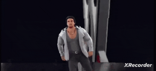 a man in a suit is dancing in front of a wwe logo .