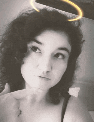 a black and white photo of a woman with curly hair