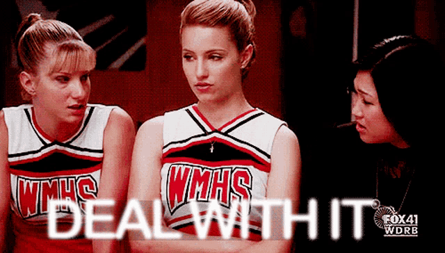 three cheerleaders wearing wmhs uniforms are standing in a locker room