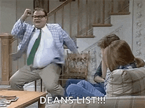 a man is dancing in front of a group of people on a couch .