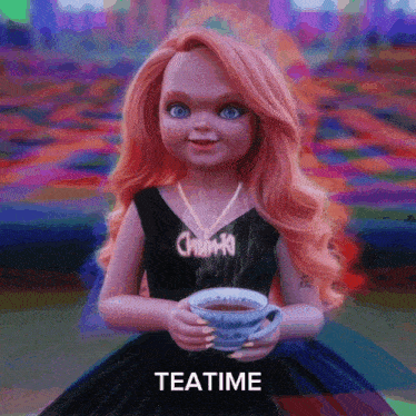 a doll in a black dress is holding a cup of tea with the word teatime below her