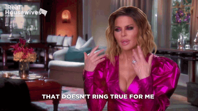 a woman in a pink dress with the words that does n't ring true for me