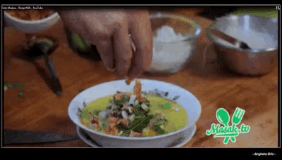 a screenshot of a youtube video shows a person preparing a dish