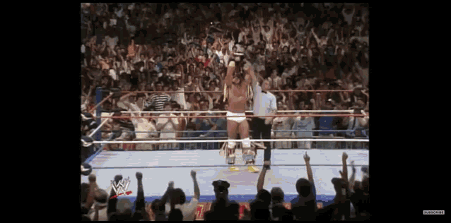 a man in a wrestling ring with a wwe logo on the bottom