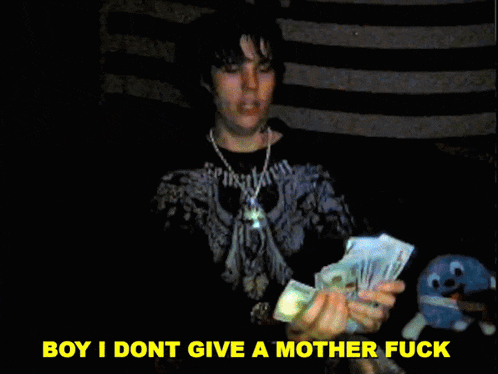 a man holding a bunch of money with the words boy i dont give a mother fuck