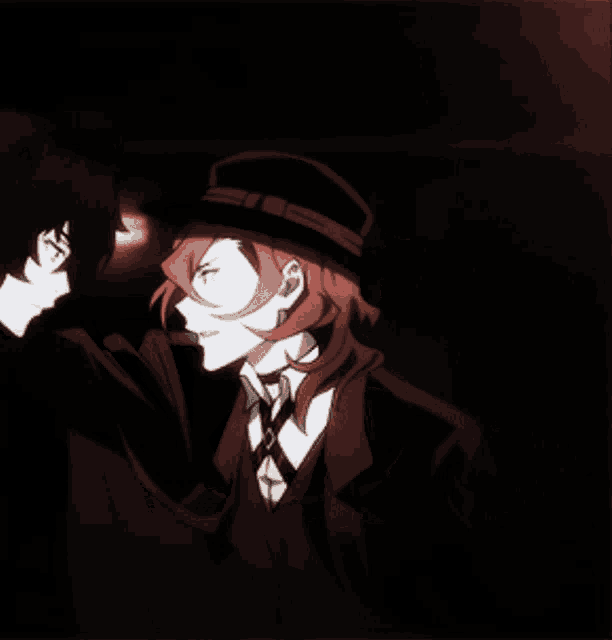 a man with red hair is standing next to another man with black hair