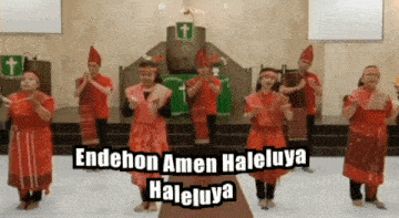 a group of people are dancing in a church with the words endehon amen haleluya written on the bottom