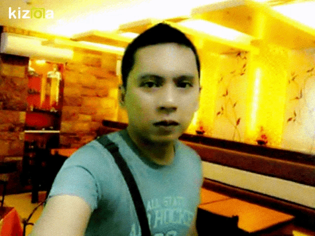 a man wearing a blue shirt that says all starts chicks takes a selfie