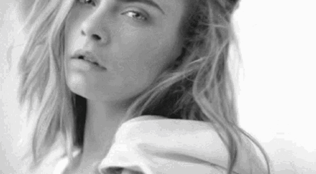 it is a black and white photo of a woman with long hair .