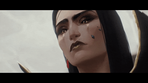 a close up of a woman 's face with tears coming down her face