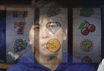 a man in a blue hoodie is playing a slot machine with a 7 on it