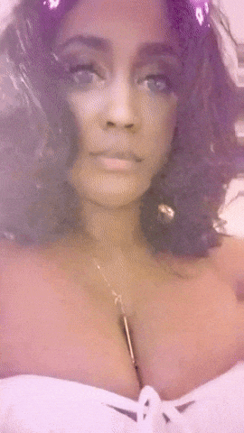 a close up of a woman 's face and chest