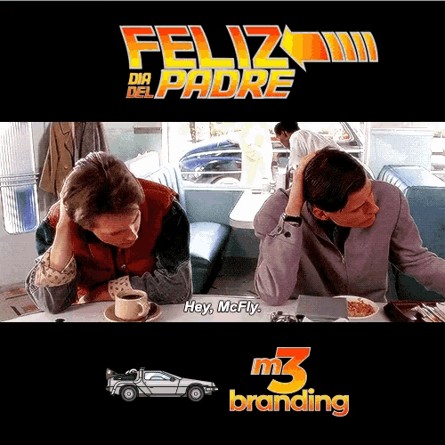 two men sit at a diner table with feliz dia del padre written on the top