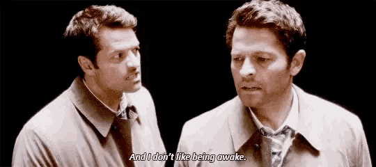 two men are standing next to each other and one of them is saying `` and i don t like being awake '' .