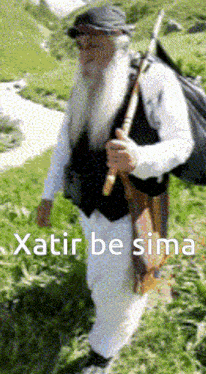 a man with a beard carrying a bag and a cane with xatir be sima written on the bottom right