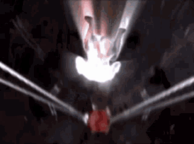a close up of a person 's face with a light coming out of it .