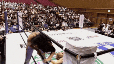 a wrestling ring with a sign that says stardom