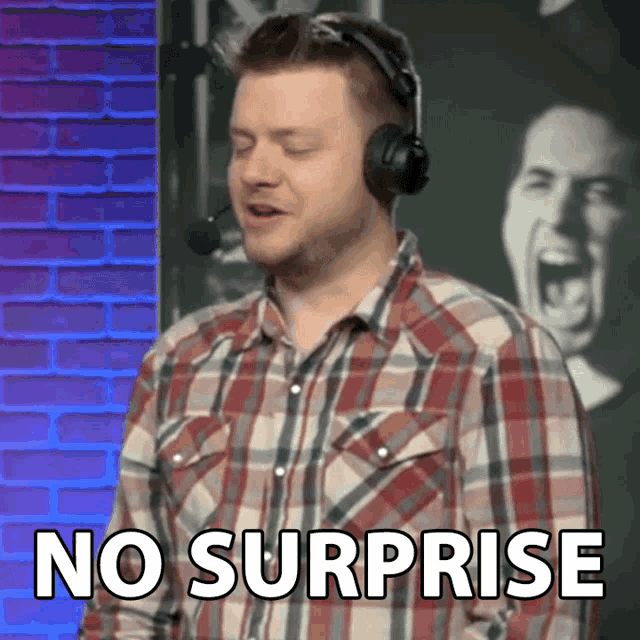 a man wearing headphones says no surprise