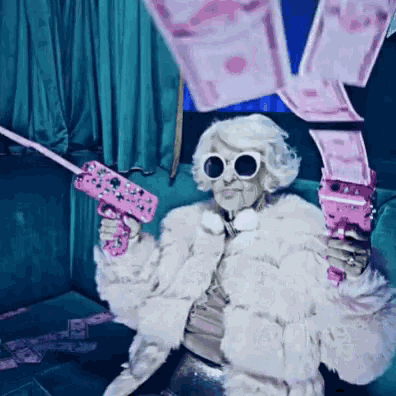 a woman in a fur coat and sunglasses is holding a pink gun
