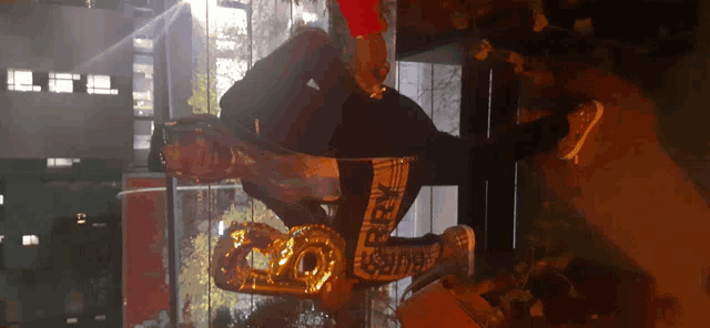 a person holding a number 20 balloon in their hand