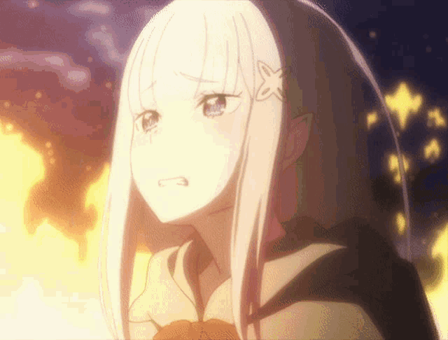 a close up of a girl with a star on her head