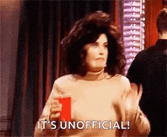 a woman is holding a red cup and saying `` it 's unofficial ! ''