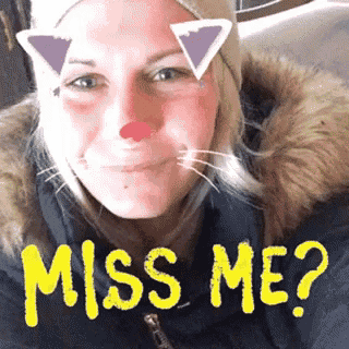 a woman with cat ears on her face and the words miss me written in yellow