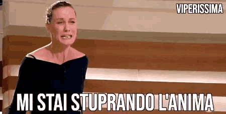 a woman is crying with the words " mi stai stuprando l' anima " below her