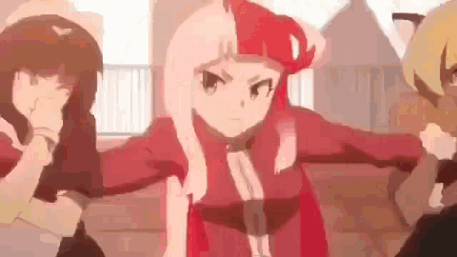 a group of anime girls are standing next to each other and fighting each other .