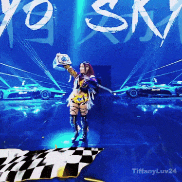 a woman stands on a stage with a checkered flag in front of a sign that says tiffany luv24