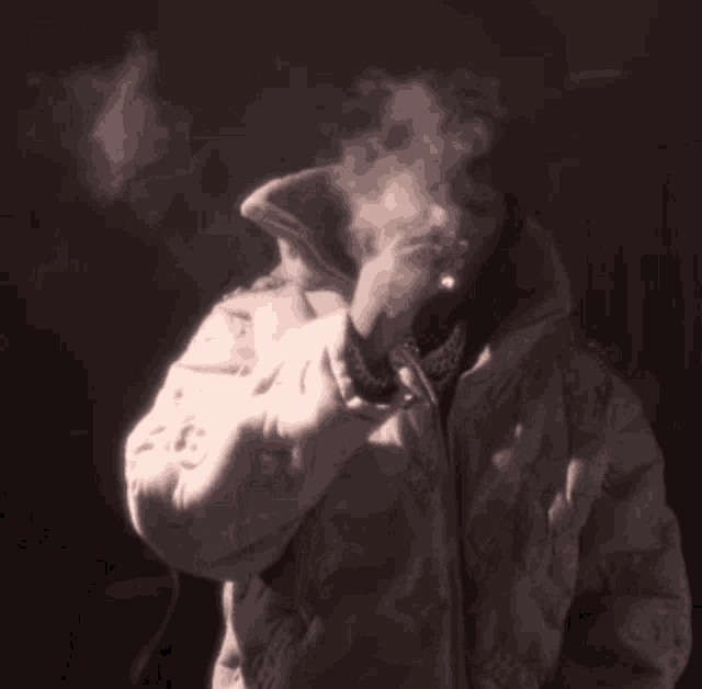 a man wearing a hat and a jacket that says chanel